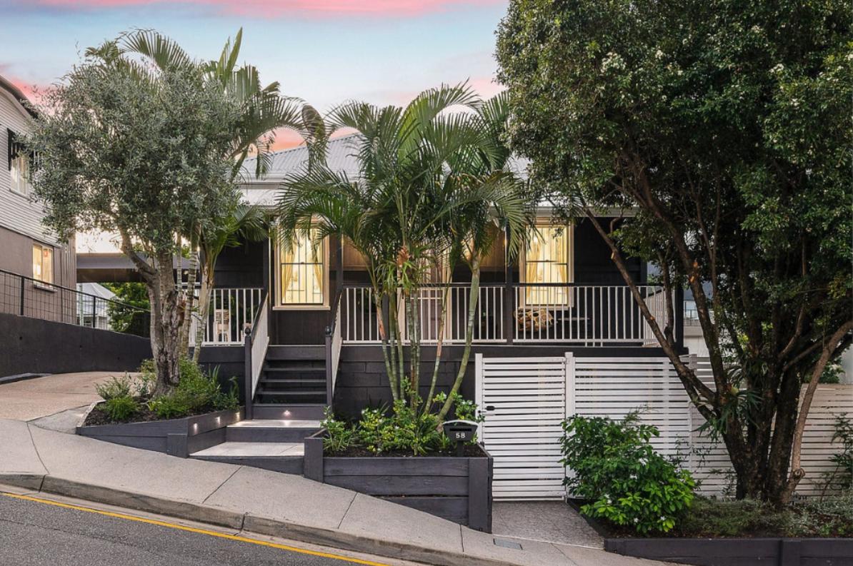 Restored Queenslander street facade at dusk