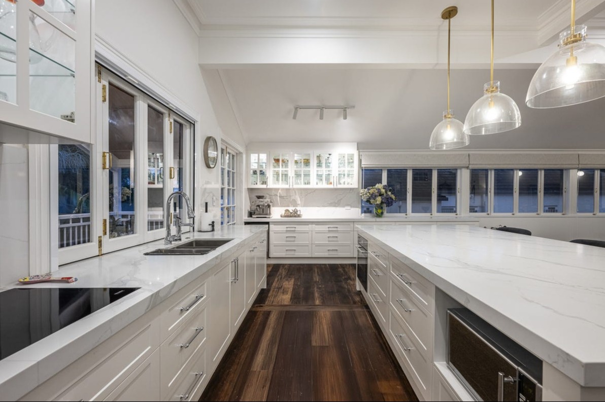 Renovated Queenslander kitchen with marble benchtops and timber floors